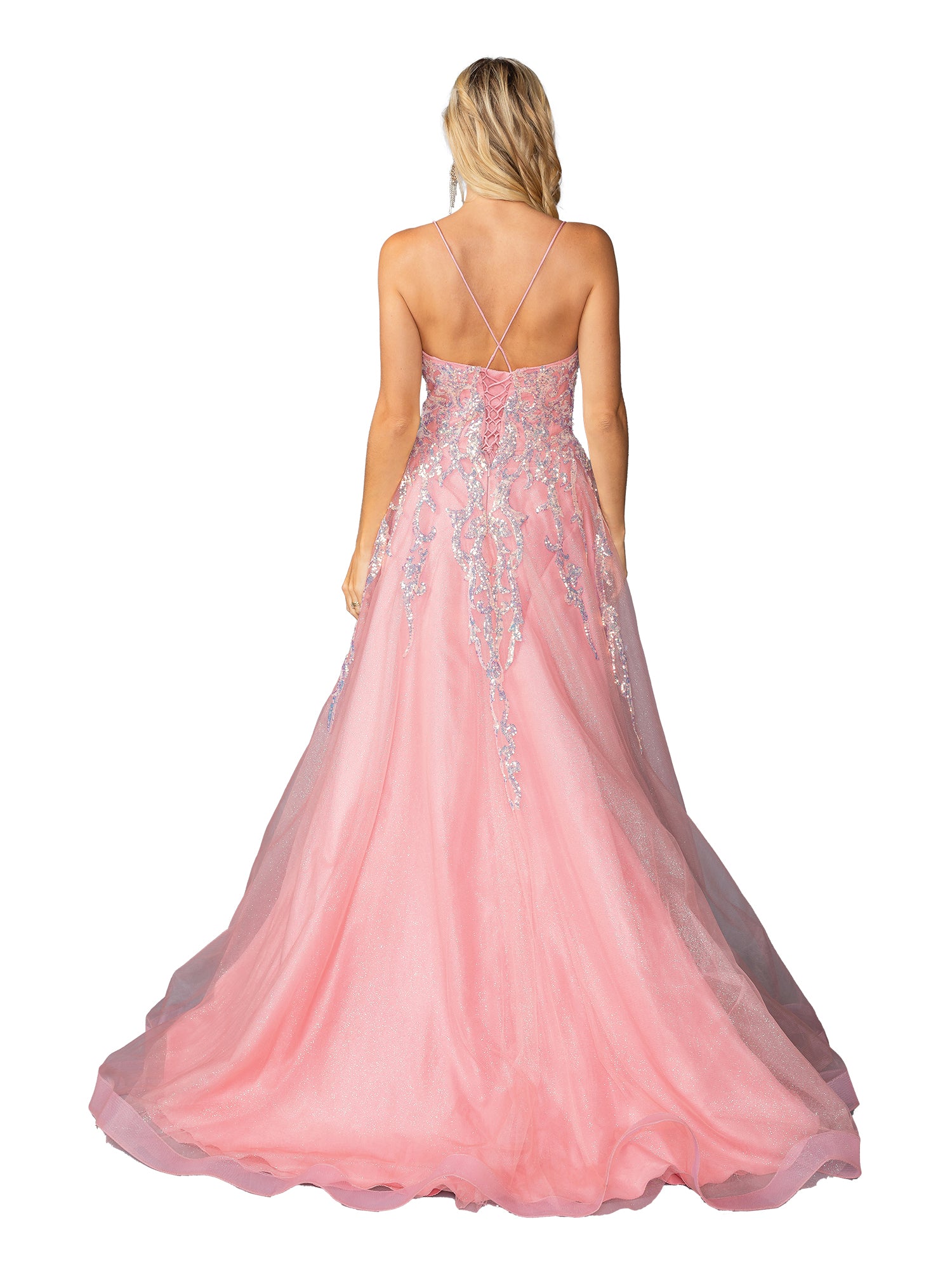 A woman in the Blush Pink Long Prom Ball Gown: Dancing Queen 4431, featuring silver sequins and thin crisscross straps, radiates elegance with its stunning back view.